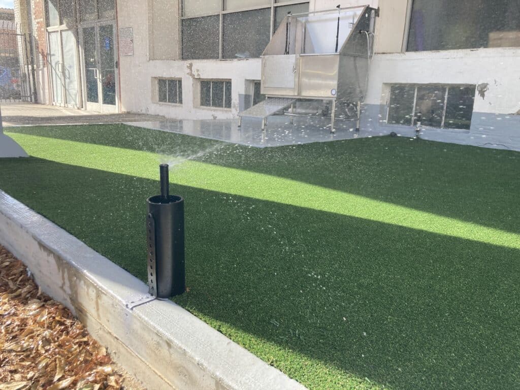 Sprinkler watering a turf space for pets